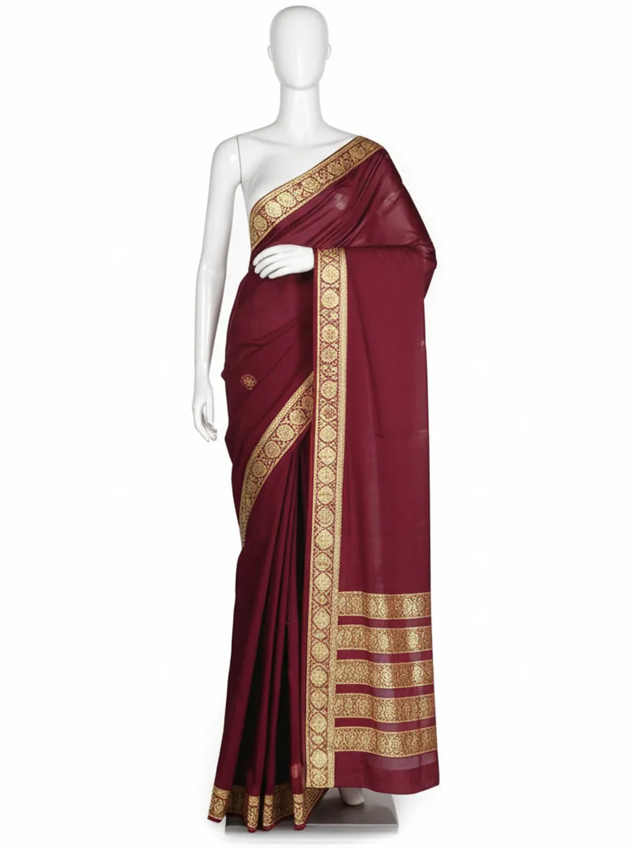 Garment photo of a maroon saree with a gold border on a mannequin